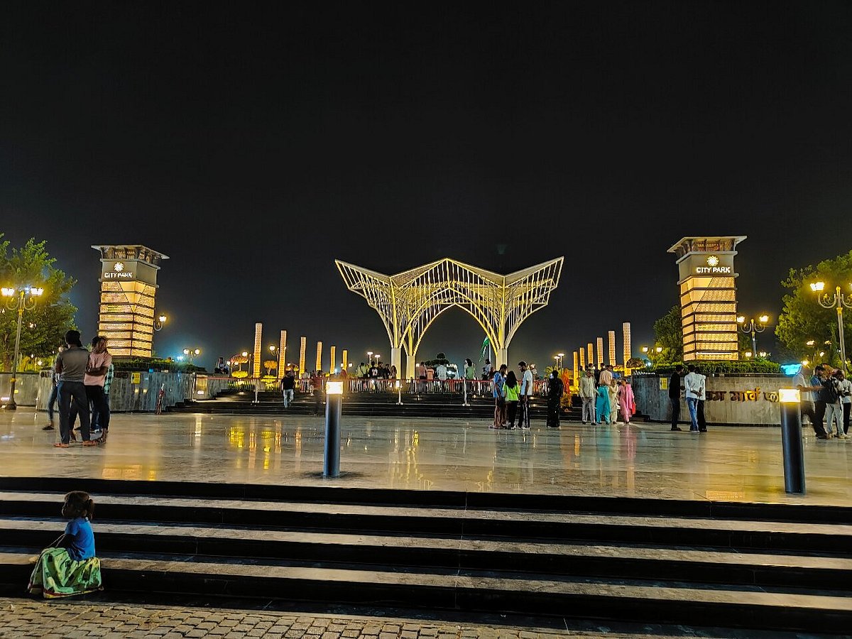 City Park in Jaipur lit up after sunset with visitors walking